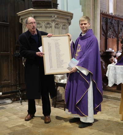 Presentation by Richard Dudding of Radley History Club of a new list of Radley's vicars to Rob Genny, vicar of Radley