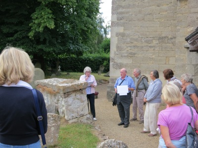 Brian and Rita Ford lead the tour of the churchyard, pausing by the Cavalier's Tomb