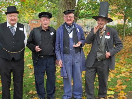 Visitors were greeted by a team of Club members dressed for the part - from left to right: Eric Blanks (stationmaster), Brian Ford (porter), Tony Rogerson (engine driver) and Denis Standen (Isambard Kingdom Brunel).