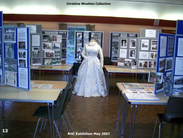 Photograph from the exhibition with the wedding dress in the centre