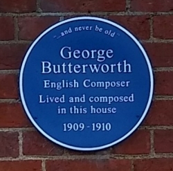 Blue plaque on the wall of The Lodge at Radley College where George Butterworth lived during his time at the College