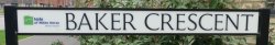 Photo of road sign for Baker Crescent at Church Farm, Radley